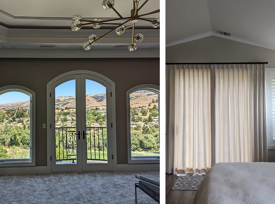 A room with two doors and a view of the mountains.