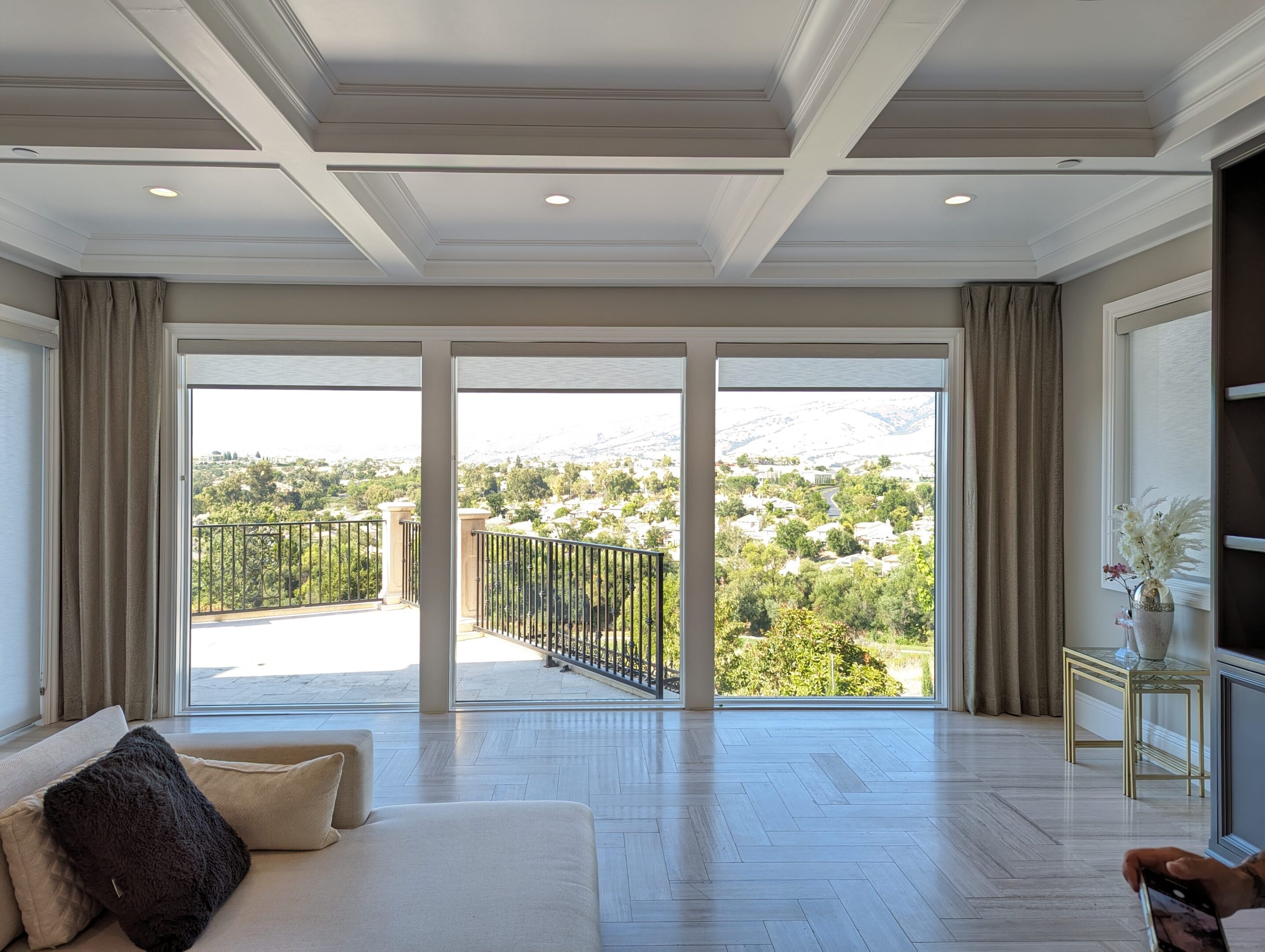 A large room with sliding glass doors and windows.